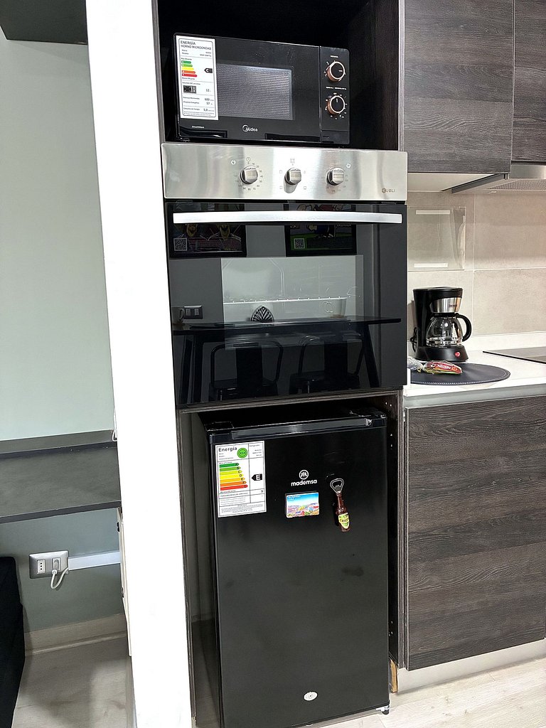Estudio con terraza privada cama king y escritorio en Santia